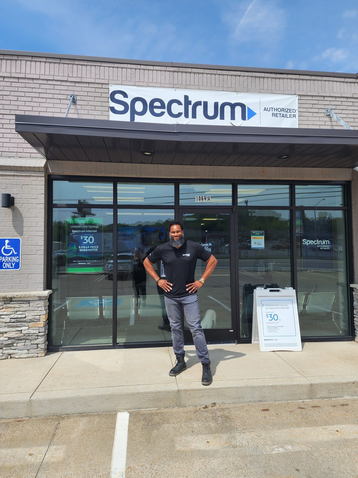 Demerus Davis standing outside the Clarksville Internet Deals Spectrum Premier Store on Riverside Drive